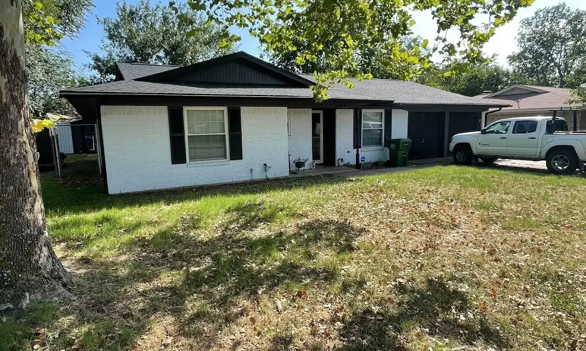 Professional roofing crew working on a residential roof in Williams